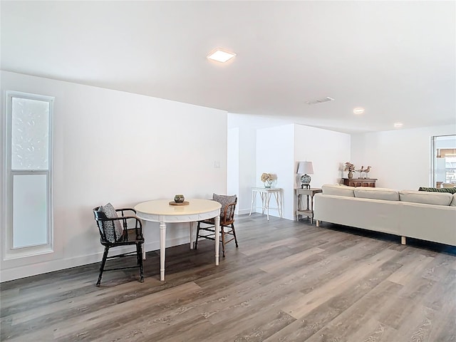 4936 Dory Dr, New Port Richey, FL 34652 - dining room with baseboards, visible vents, and wood finished floors