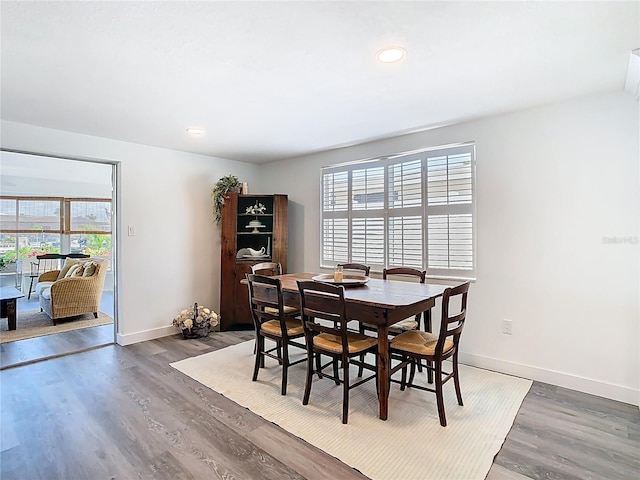 4936 Dory Dr, New Port Richey, FL 34652 - dining space with baseboards, wood finished floors, and recessed lighting
