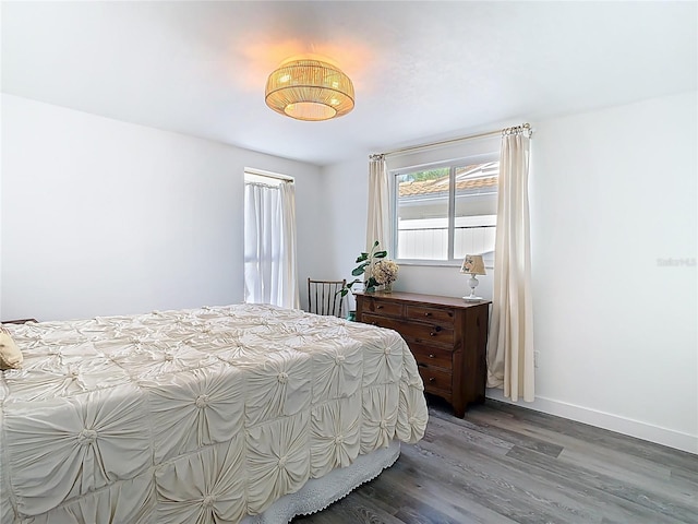 4936 Dory Dr, New Port Richey, FL 34652 - bedroom with baseboards and wood finished floors