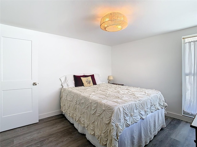 4936 Dory Dr, New Port Richey, FL 34652 - bedroom with baseboards and wood finished floors