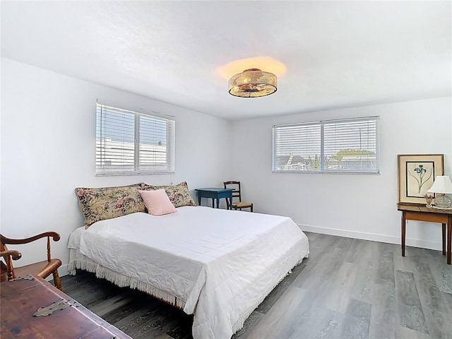 4936 Dory Dr, New Port Richey, FL 34652 - bedroom with baseboards and wood finished floors