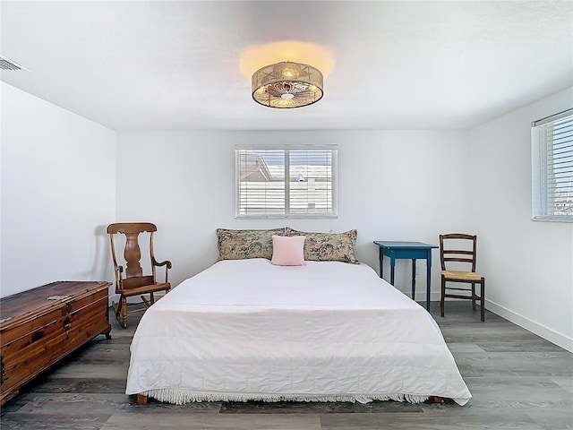 4936 Dory Dr, New Port Richey, FL 34652 - bedroom with visible vents, multiple windows, and wood finished floors