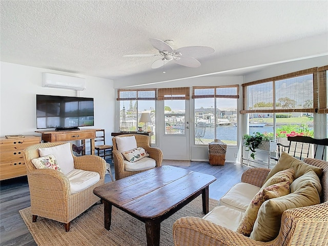 4936 Dory Dr, New Port Richey, FL 34652 - living room with a wall mounted air conditioner, wood finished floors, a ceiling fan, and plenty of natural light