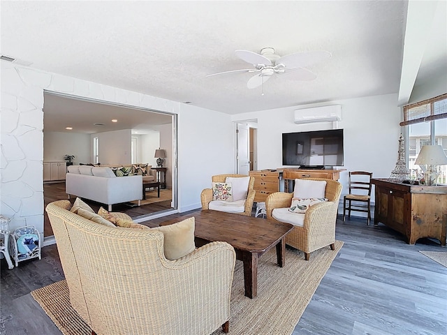 4936 Dory Dr, New Port Richey, FL 34652 - living area with an AC wall unit, visible vents, wood finished floors, and ceiling fan