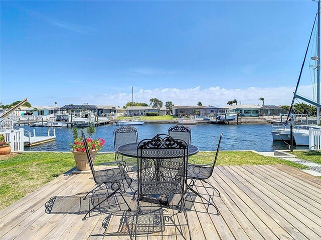 4936 Dory Dr, New Port Richey, FL 34652 - dock area featuring a water view and a lawn