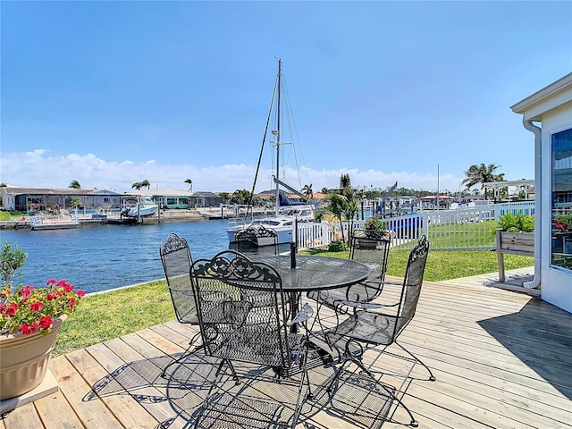 4936 Dory Dr, New Port Richey, FL 34652 - deck with a yard, a water view, fence, and outdoor dining space