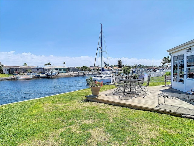 4936 Dory Dr, New Port Richey, FL 34652 - dock area featuring a lawn and a water view