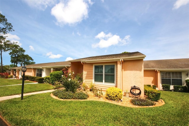 9321 Whitstone Ct, New Port Richey, FL 34655 - ranch-style home featuring stucco siding and a front lawn