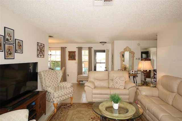 9321 Whitstone Ct, New Port Richey, FL 34655 - tiled living area featuring a textured ceiling and visible vents