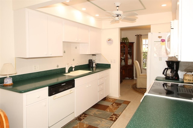 9321 Whitstone Ct, New Port Richey, FL 34655 - kitchen featuring a sink, tasteful backsplash, white dishwasher, white cabinets, and ceiling fan
