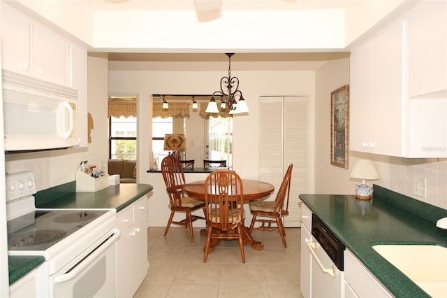 9321 Whitstone Ct, New Port Richey, FL 34655 - dining space featuring a chandelier and light tile patterned floors