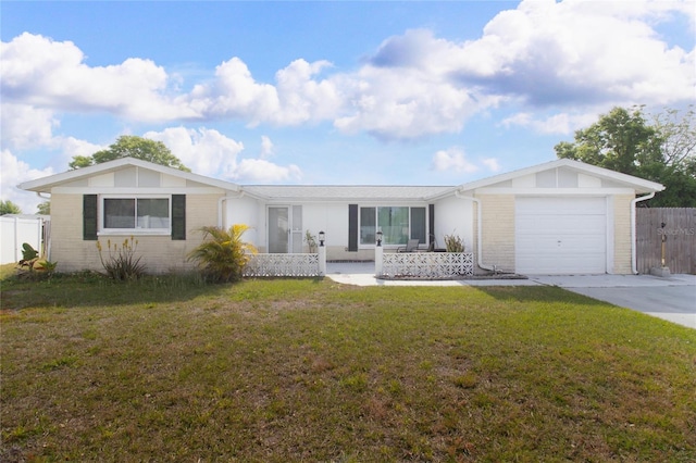 2620 Baltic Pl, Holiday, FL 34691 - single story home featuring a garage, concrete driveway, a front lawn, and fence
