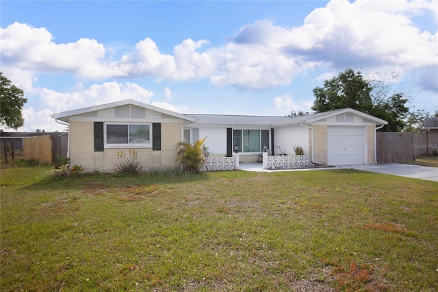 2620 Baltic Pl, Holiday, FL 34691 - single story home with fence, an attached garage, a front lawn, and concrete driveway