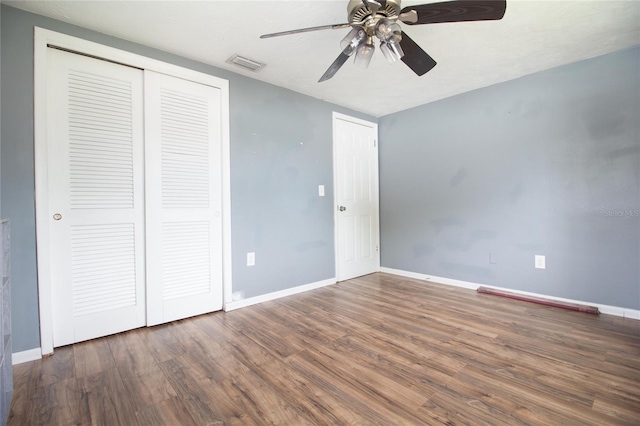 2620 Baltic Pl, Holiday, FL 34691 - unfurnished bedroom with baseboards, a ceiling fan, wood finished floors, and visible vents