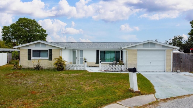 2620 Baltic Pl, Holiday, FL 34691 - single story home featuring an attached garage, driveway, a front lawn, and fence