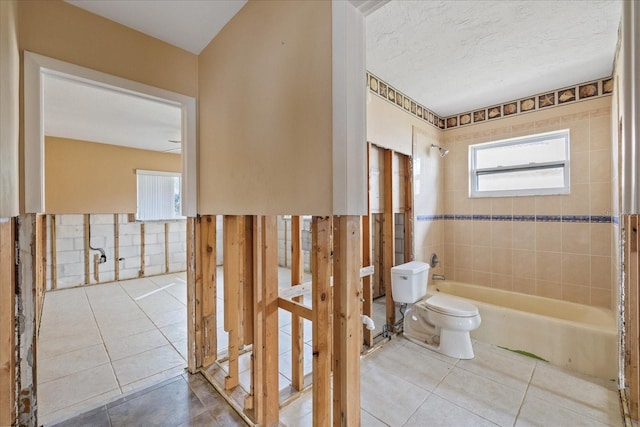 5000 Southshore Dr, New Port Richey, FL 34652 - full bathroom featuring tile patterned floors,  shower combination, and healthy amount of natural light