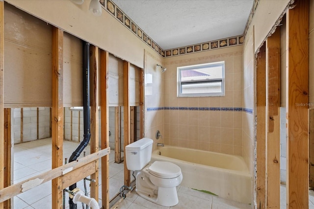 5000 Southshore Dr, New Port Richey, FL 34652 - full bathroom with bathtub / shower combination, tile patterned flooring, and a textured ceiling