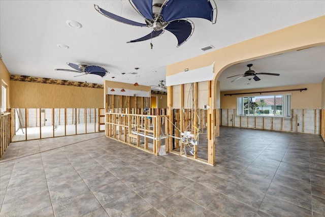 5000 Southshore Dr, New Port Richey, FL 34652 - miscellaneous room with a ceiling fan and arched walkways