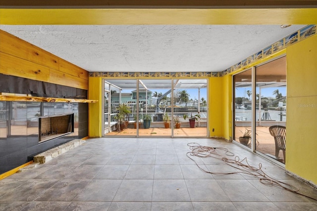 5000 Southshore Dr, New Port Richey, FL 34652 - unfurnished sunroom with a water view