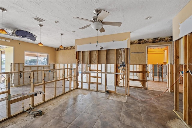 5000 Southshore Dr, New Port Richey, FL 34652 - miscellaneous room with a ceiling fan and a textured ceiling