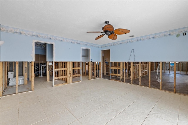 5000 Southshore Dr, New Port Richey, FL 34652 - unfurnished room featuring a ceiling fan and tile patterned floors