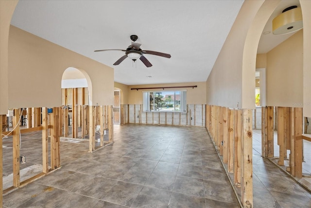 5000 Southshore Dr, New Port Richey, FL 34652 - empty room featuring a ceiling fan and a wainscoted wall