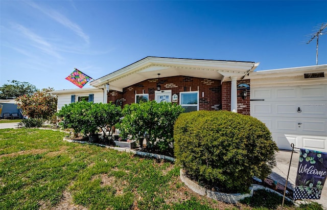 4107 Glissade Dr, New Port Richey, FL 34652 - ranch-style house with brick siding, a garage, and a front yard