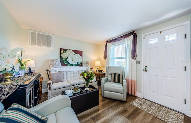 4107 Glissade Dr, New Port Richey, FL 34652 - living area featuring baseboards, visible vents, and dark wood finished floors