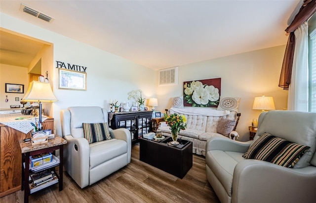 4107 Glissade Dr, New Port Richey, FL 34652 - living area with visible vents and wood finished floors