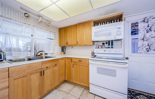 4107 Glissade Dr, New Port Richey, FL 34652 - kitchen with light countertops, open shelves, white appliances, light tile patterned floors, and a sink