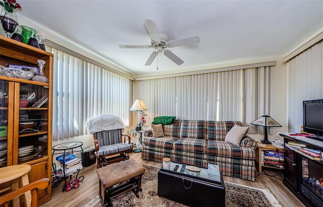 4107 Glissade Dr, New Port Richey, FL 34652 - living area with ceiling fan and wood finished floors