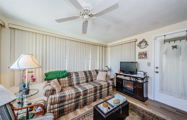 4107 Glissade Dr, New Port Richey, FL 34652 - living room with light wood-style floors and ceiling fan