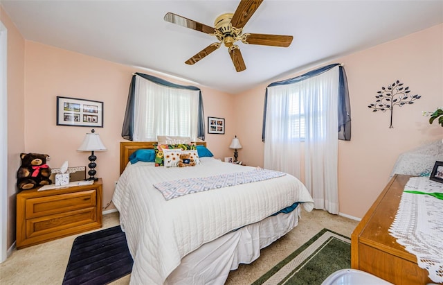 4107 Glissade Dr, New Port Richey, FL 34652 - bedroom featuring light carpet, baseboards, and a ceiling fan