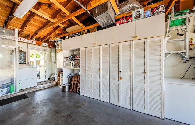4107 Glissade Dr, New Port Richey, FL 34652 - garage featuring white fridge and washer / dryer