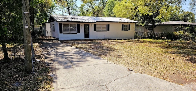 807 S Castle Ct, Tampa, FL 33612 - ranch-style home featuring driveway, fence, and metal roof