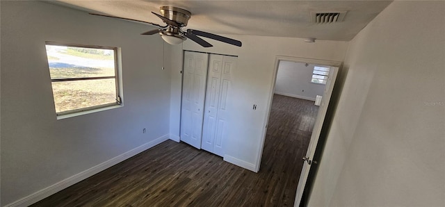 807 S Castle Ct, Tampa, FL 33612 - unfurnished bedroom featuring dark wood-style flooring, a closet, baseboards, and visible vents
