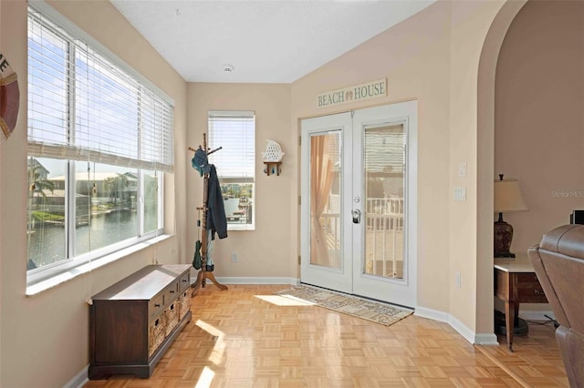 4058 Centavo Ct, Hernando Beach, FL 34607 - entryway with french doors, arched walkways, and baseboards