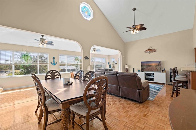 4058 Centavo Ct, Hernando Beach, FL 34607 - dining area with a ceiling fan, high vaulted ceiling, and baseboards