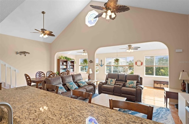 4058 Centavo Ct, Hernando Beach, FL 34607 - living area with arched walkways, a ceiling fan, and high vaulted ceiling