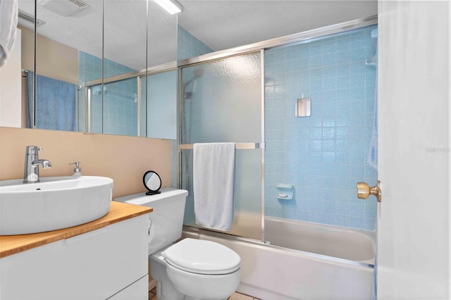 4058 Centavo Ct, Hernando Beach, FL 34607 - full bathroom featuring shower / bath combination with glass door, vanity, and toilet