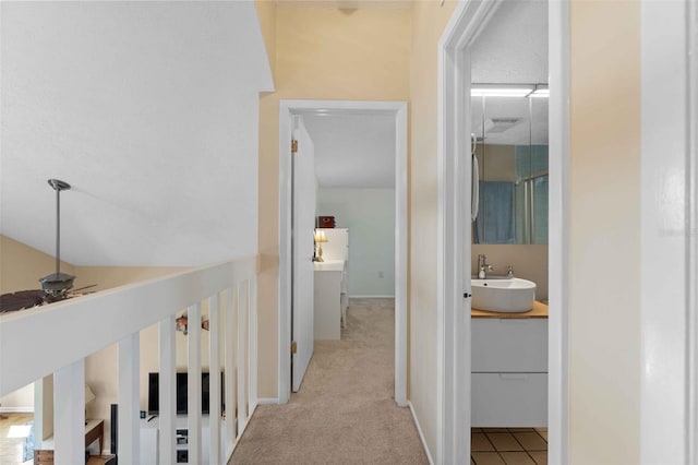 4058 Centavo Ct, Hernando Beach, FL 34607 - corridor featuring a sink, carpet, and baseboards