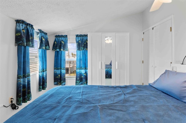 4058 Centavo Ct, Hernando Beach, FL 34607 - bedroom featuring vaulted ceiling, a textured ceiling, and a ceiling fan