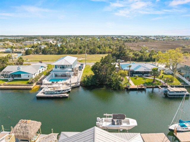 4058 Centavo Ct, Hernando Beach, FL 34607 - aerial view of residential area featuring a nearby body of water and a tree filled landscape
