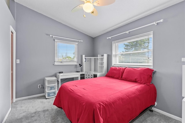bedroom featuring carpet flooring, baseboards, lofted ceiling, and ceiling fan