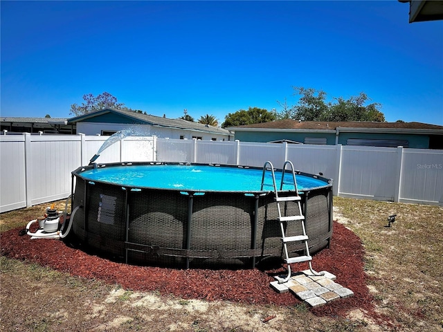 view of yard featuring a fenced backyard and a fenced in pool