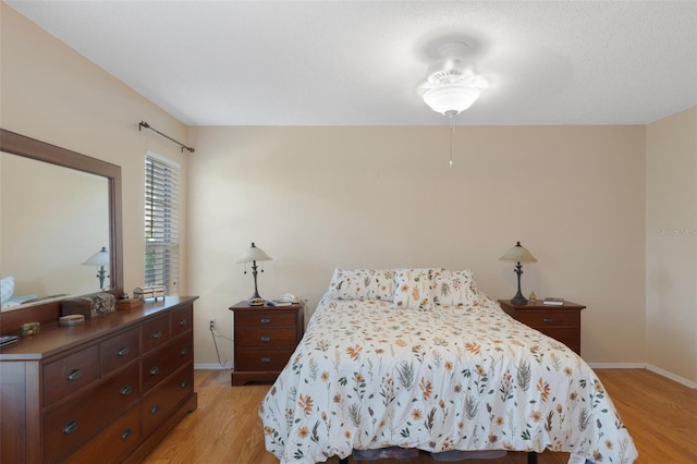 6530 Pine Meadows Dr, Spring Hill, FL 34606 - bedroom with baseboards and light wood-style floors