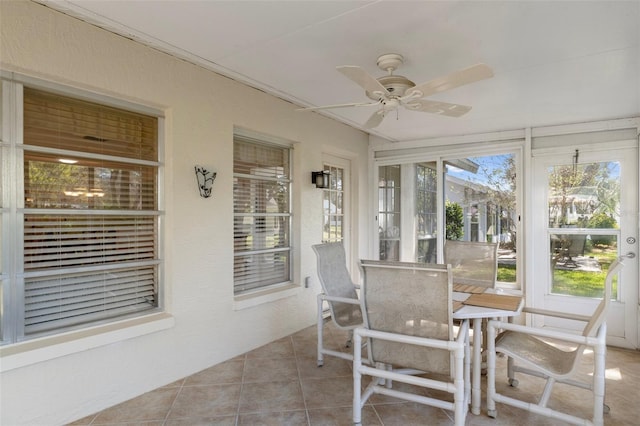 6530 Pine Meadows Dr, Spring Hill, FL 34606 - sunroom with tile patterned floors, outdoor dining area, and a ceiling fan