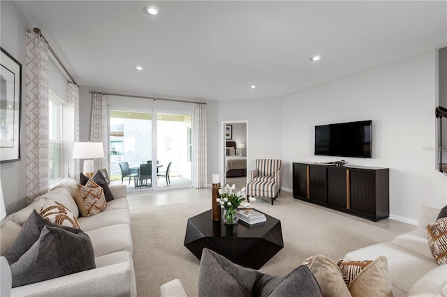 living room with light carpet, baseboards, recessed lighting, and light tile patterned floors