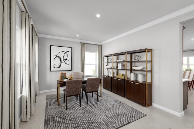office area with light tile patterned floors, ornamental molding, and baseboards