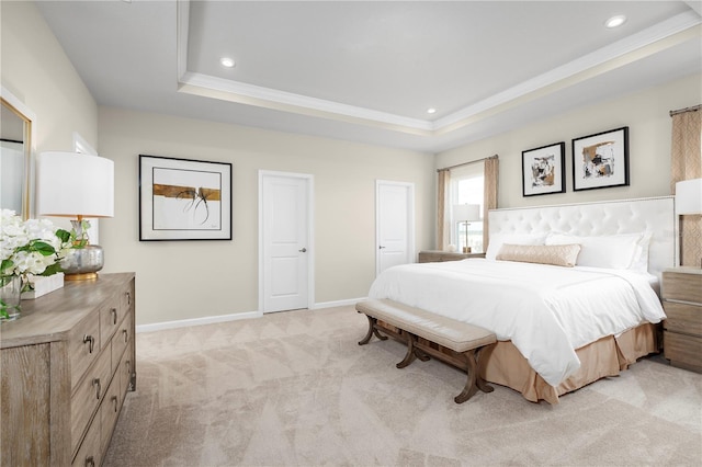 bedroom featuring baseboards, light colored carpet, recessed lighting, and a raised ceiling